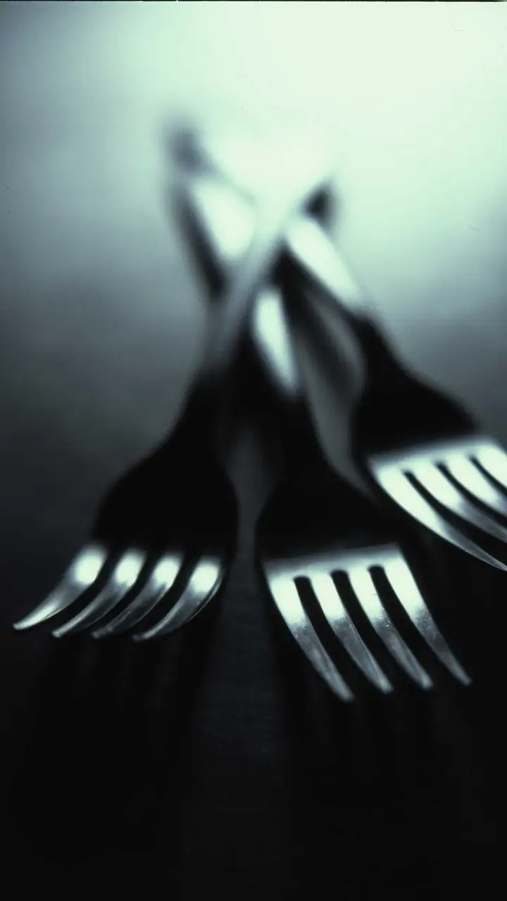 Three forks in soft light